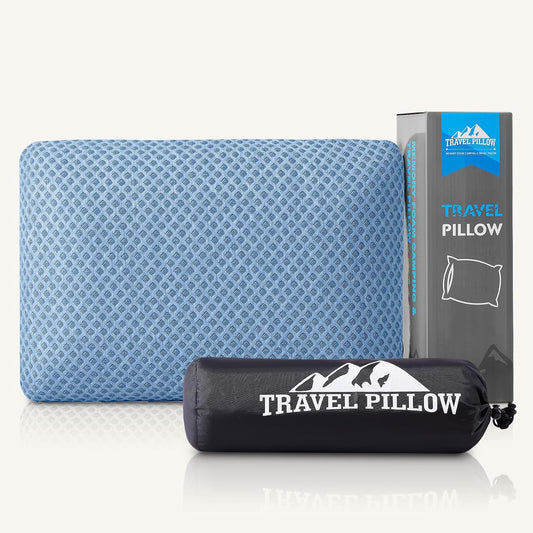 CushyOasis shredded memory foam travel pillow with washable cover, eye mask, and earplugs for neck support and comfort during travel.